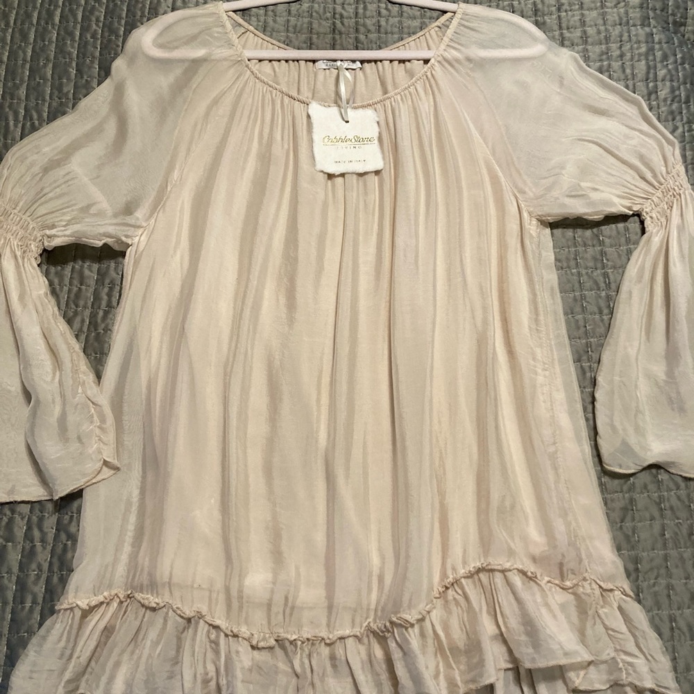 Italian silk blouse with bell sleeves and ruffle shirttail. Beautiful bone color